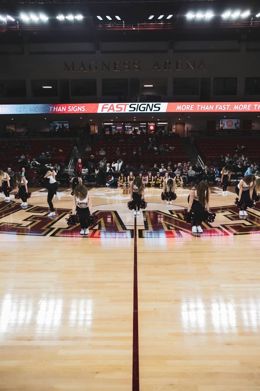 college dance team performing at a basketball game