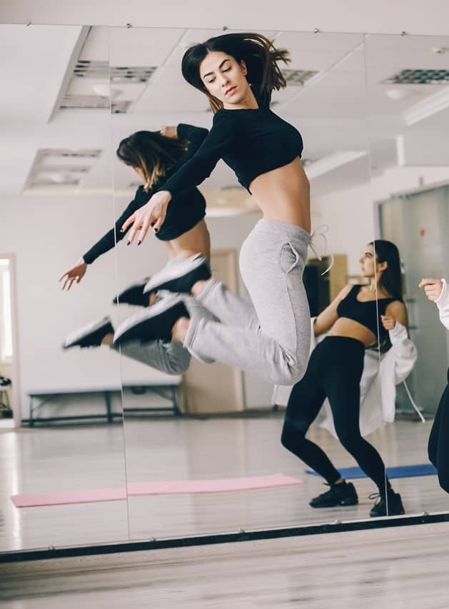 dancer leaping in a studio